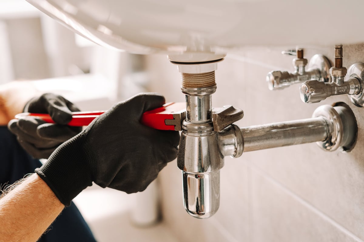 Professional plumber at work